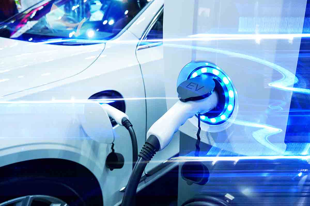 Commercial EV Charging Point Installation | Global Installation Cable electric car plugged in to ev charging point station in car park